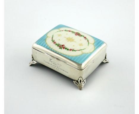 A silver and enamel dressing table box, maker's mark worn, Birmingham 1911, rectangular form, the hinged cover enamelled with