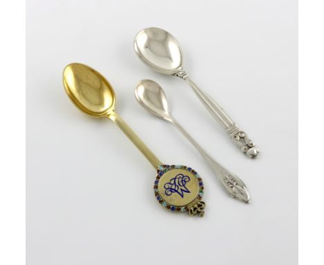 By Georg Jensen, a Danish silver mustard spoon, length 12.7cm, plus an Acorn pattern spoon, design number 77, stylised classi