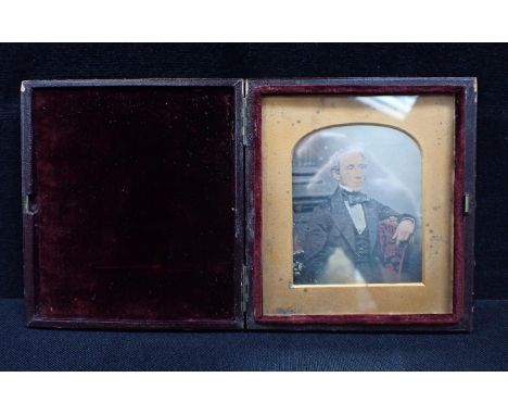 A CASED DAGUERROTYPE PHOTOGRAPH by T R Williams, London, a Victorian gentleman, hand coloured, c1860