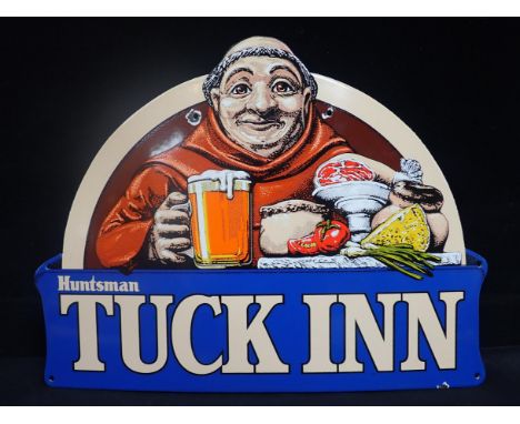 AN ENAMEL SIGN 'HUNTSMAN, TUCK INN' depicting the Friar with his repast 45 x 59cm (chips around fixing holes)