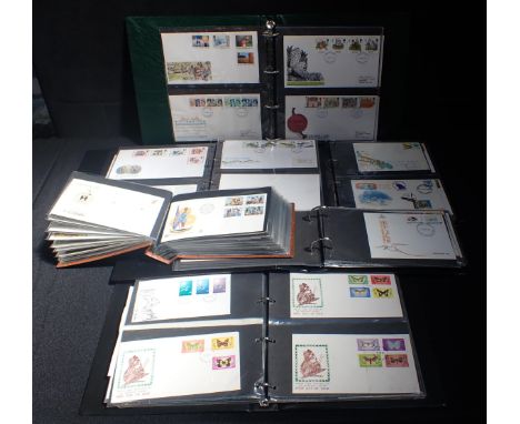 A QUANTITY OF FIRST DAY COVERS in six albums
