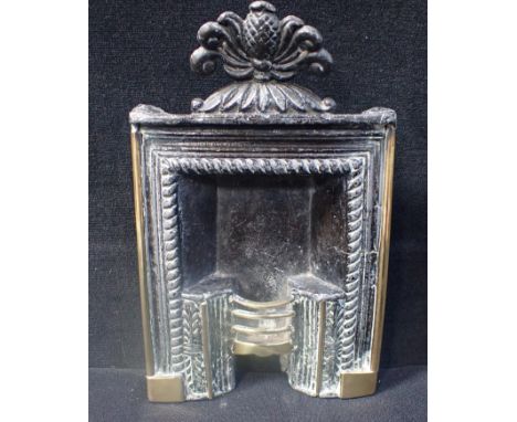 A 19th CENTURY CAST LEAD AND BRASS MINIATURE FIREPLACE 23cm high