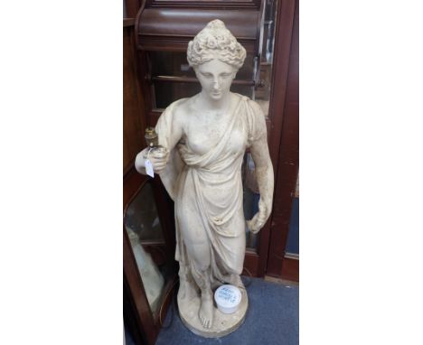 A PLASTER STATUE, IN THE CLASSICAL STYLE of a robed woman holding a small wreath, the other hand now fitted for a lamp (damag