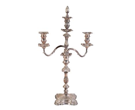 A VICTORIAN SILVER PLATED TRIPLE SCONCE CANDLEBRA by William Hutton &amp; Sons of Sheffield, with leaf mounts, square sconces