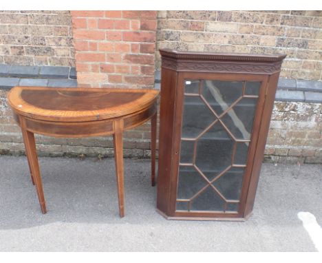 A FOLD-OVER DEMI-LUNE CARD TABLE with satinwood crossbanding 94cm wide, and a small hanging corner cabinet with blind fret fr