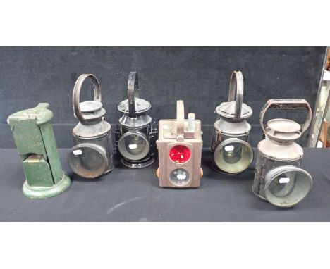 FOUR OLD METAL RAILWAY GUARD'S LAMPS two embossed BR, with a modern French SNCF guard's lamp and a ticket machine, numbered R