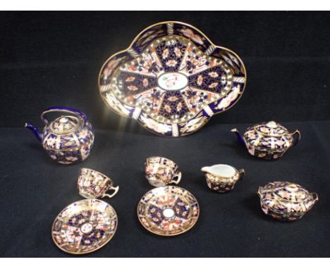A MATCHED ROYAL CROWN DERBY MINIATURE TEA SET , IMARI PATTERN 6299 including tray and kettle, two cups and saucers, teapot, s