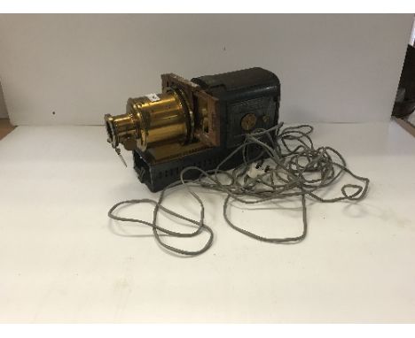 An early 20th Century lacquered brass and tin plate magic lantern bearing plaque inscribed "Patent No. 245", together with ap
