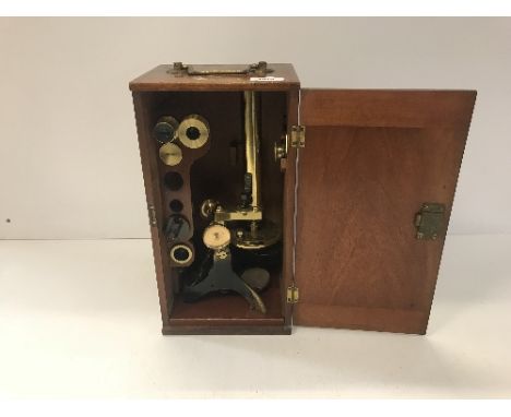 A circa 1900 mahogany cased lacquered brass and black painted monocular microscope, un-named, case 36.5 cm high