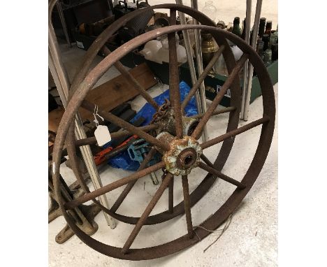 Two cast and wrought iron wheels, together with a Lake &amp; Elliot Millennium Magneto vice and an early cast iron and lead b