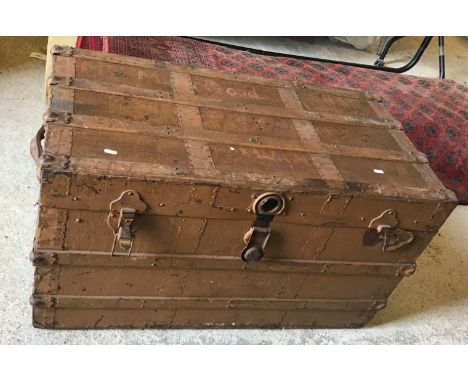 A painted tin and canvas trunk, 93 cm long x 52 cm high