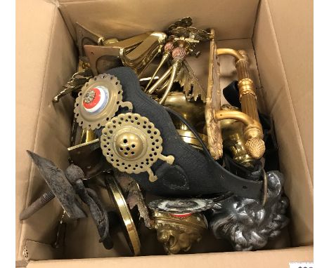 A collection of various brass and other metal wares to include Louis XV style acanthus sabots, a pair of lion mask door handl