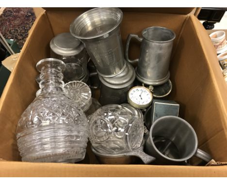 A collection of pewter tankards, glass decanters and an over-sized pocketwatch, the white enamel dial set with Arabic numeral