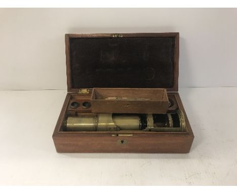 A Victorian lacquered brass simple monocular brass microscope with various accessories and ivory and glass mounted slides, to
