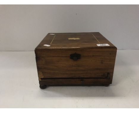 A 19th Century walnut cased table top polyphon with paper label to interior of lid, together with 23 x 20.7 cm discs, box 26 