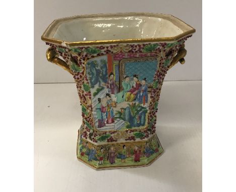 A 19th Century Chinese famille rose and relief work decorated vase of canted square tapered form, the sides with figural scen