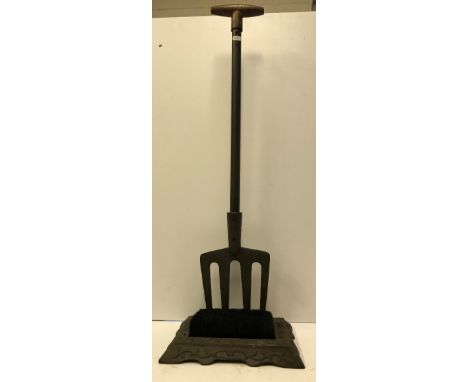 A modern iron "garden fork" boot scrape with brush