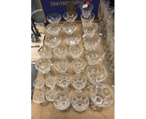 A set of early 20th Century Val St Lambert facet cut drinking glasses including four red wines, two saucers, eleven white win