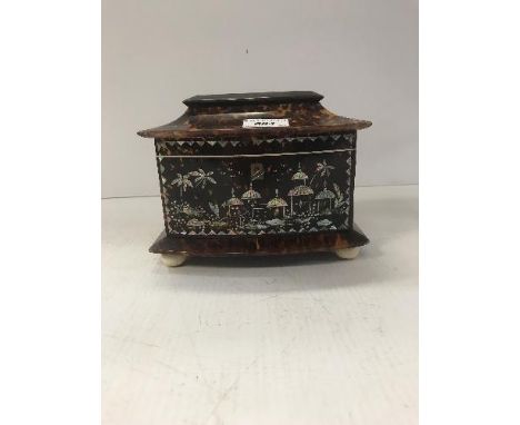 A Regency tortoiseshell veneered tea caddy inlaid in mother of pearl with chinoiserie decorated depicting pagodas in a landsc