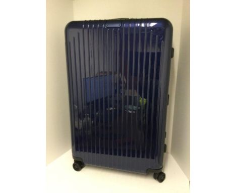 RIMOWA - a blue gloss essential light check in suitcase