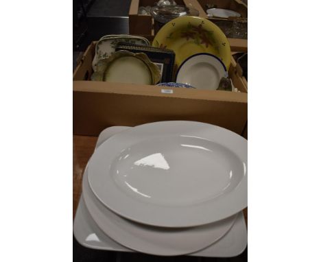 A box of Crown Ducal Florentine patterned dinnerware, The Spode Blue Room Collection plates, place mats, and other items
Gene