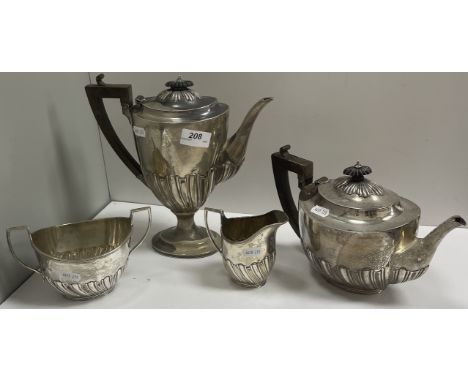 A late Victorian silver semi gadrooned oval tea set with tea pot, hot water jug, sugar basin and cream jug (by Charles Stuart