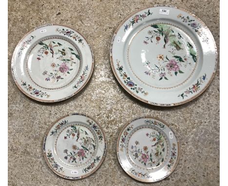 An 18th Century Chinese Qing Dynasty famille rose double peacock pattern charger 41 cm diameter together with a matching plat