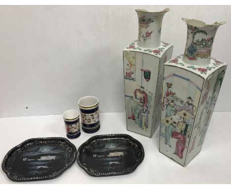 A pair of 19th Century Chinese famille rose vases of tapered square form with cylindrical necks and flared rims, the main bod