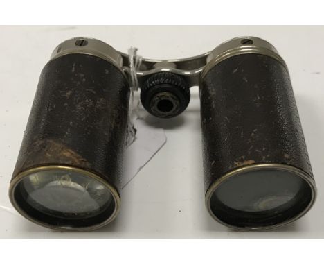 A pair of late 19th Century Frodsham type folding opera or field glasses, the lenses folding into their own covers, with leat