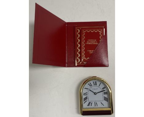 A Romane Cartier travel alarm clock, No'd. "10250" to back, with certificate of guarantee and further booklet, 8.5 cm high