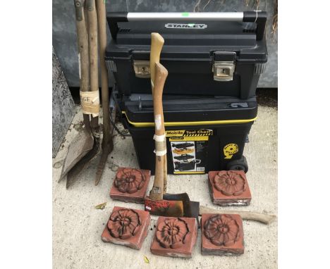 Two plastic heavy duty Stanley toolboxes, together with a collection of axes and shovels and five terracotta tiles with Tudor