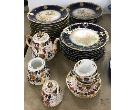 A Gerard, Dufraisseix & Abbot Limoges porcelain dessert service with floral spray decoration within a gilt and blu royal bord