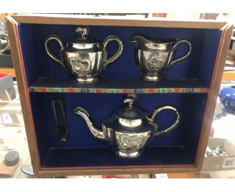A Chinese silver tea set with dragon, bullrush, floral and bamboo decorated panels and bamboo design handles, comprising teap