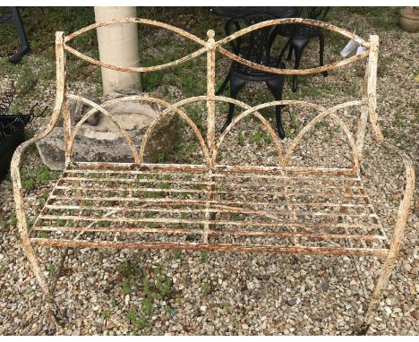 A 19th Century white painted wrought iron hoop back two seat garden bench on pad feet, 127 cm wide x 49 cm deep x 100 cm high