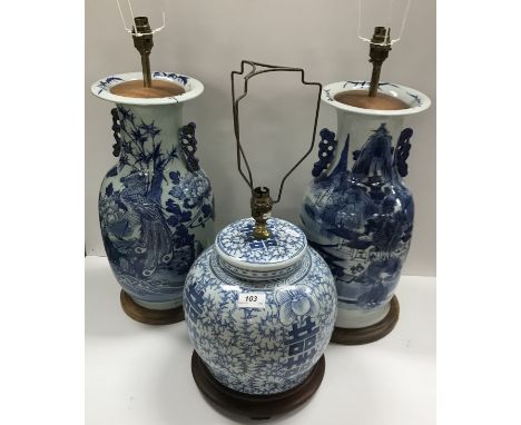 Two Chinese blue and white vases as table lamps, one decorated with peacock amongs blossoming foliage 45 cm high not includin
