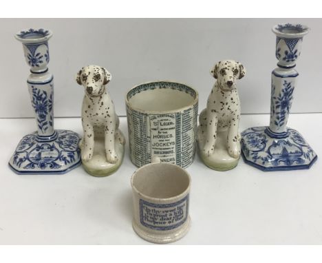 A pair of Miranda C Smith pottery dalmation figures 16 cm high, a pair of Delft blue and white candlesticks 18.5 cm high, a m