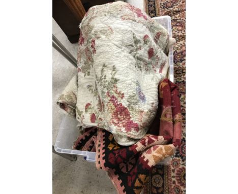 A box containing various textiles to include a modern Durham style quilt with floral pattern to one side, together with vario