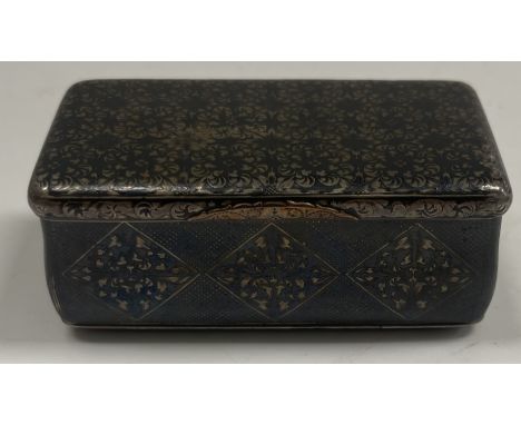 A mid 19th Century Russian niello silver waisted hinge-lidded box with tiled foliate decoration, bears "84 Zlotnik Moscow 188