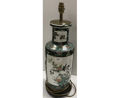 A 19th Century Chinese famille vert rouleau vase with black banding as a lamp decorated with birds amongst blossom (drilled t