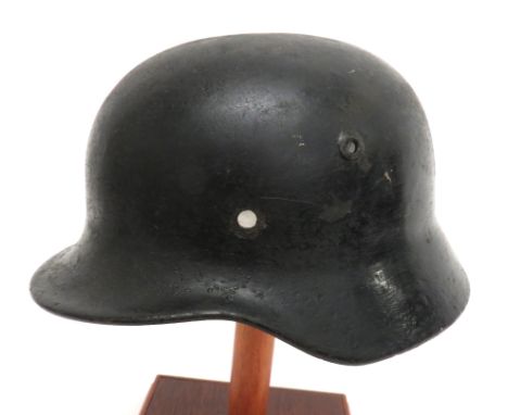 WW2 German Third Reich M1940 Steel Helmet black, repainted shell with lower rolled edge brim. &nbsp;Punched air vent hole. &n