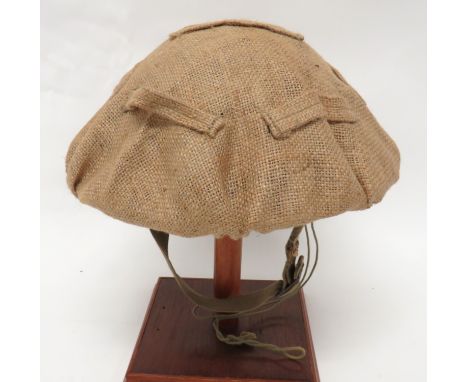 Rare 1942 Dated Sandbag Helmet Cover coarse hessian sandbag disc with lower tightening band. &nbsp;The crown with six camoufl