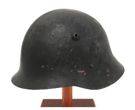 Bulgaria M1936 Steel Helmet black overpainted, faint ridge crown. &nbsp;Lower raw edge brim. Applied vent hole. &nbsp;Lower b