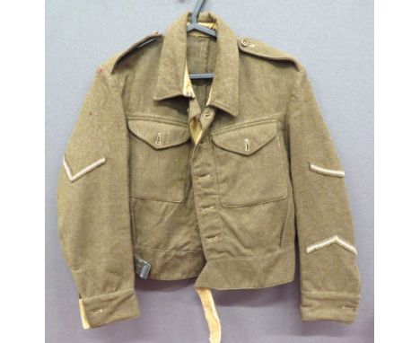 WW2 1940 Pattern Battledress Jacket Dated 1945 khaki woollen, single breasted, closed collar, short jacket. &nbsp;Lower exten