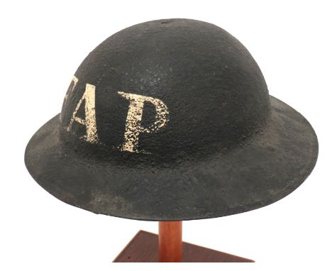 WW2 F.A.P. Reused WW1 Brodie Steel Helmet black overpainted green, steel crown. &nbsp;The front and rear with hand painted "F