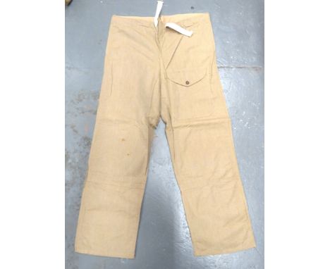 WW2 Windproof Drab Over Trousers Dated 1942 khaki brown, cotton over trousers. &nbsp;Front of left leg with patch pocket with