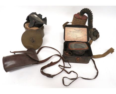 Four Various WW2 Respirators consisting civilian pattern contained in a ""Tala Respirator"" container ... Civilian pattern co