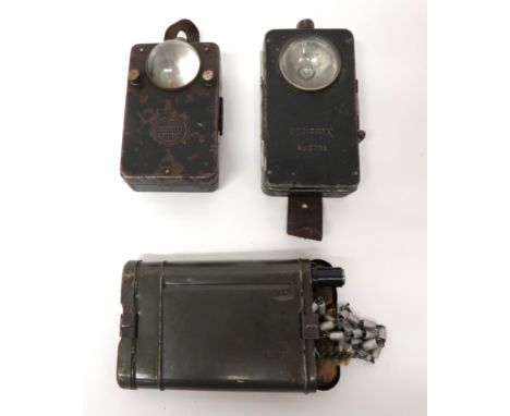 Two German Issue Torches And A Rifle Cleaning Kit black painted, rectangular boxes with front lens. &nbsp;The fronts marked "