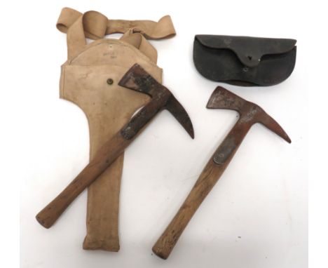 Two Civil Defence Home Front Fire Axes consisting steel head with rear spike. &nbsp;Steel securing shoulders. &nbsp;Head with