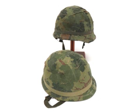 Two Post War American Pattern Steel Helmets green painted steel shells. &nbsp;Fibre inner helmets with webbing and leather li