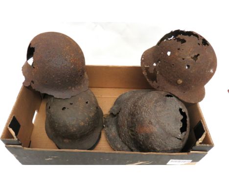 Seven WW2 Excavated Steel Helmets consisting 2 x British examples ... 1 x French WW1 pattern ... 4 x German examples. &nbsp;A